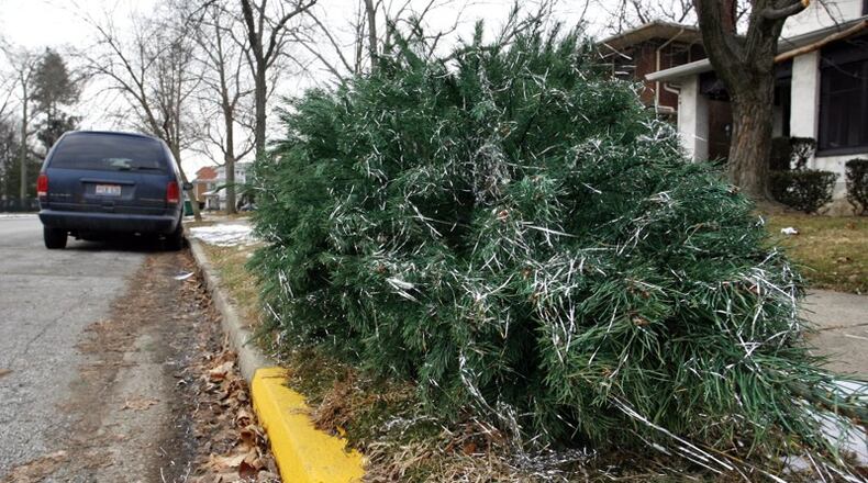 DeKalb County is offering curbside Christmas tree collection through Jan. 10. AJC file photo