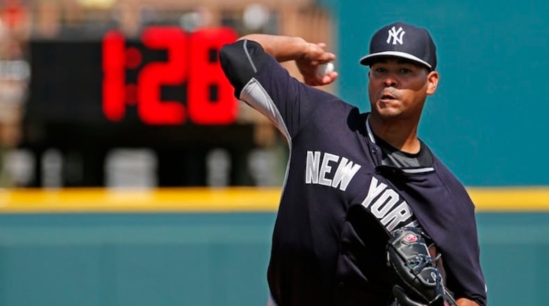 FILE - In this March 5, 2015, file photo, New York Yankees pitcher Esmil Rogers (53) warms up between innings of a spring training exhibition baseball game against the Pittsburgh Pirates game in Bradenton, Fla. The average time of a nine-inning game this season is a record 3 hours, 5 minutes, up from 3:00 last year and 2:56 in 2015. MLB is threatening to impose new pace rules for 2018, even if players don't agree. (AP Photo/Gene J. Puskar, File)