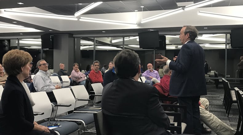 State Sen. Fran Millar, who represents part of Peachtree Corners, addresses a resident during a Wednesday night meeting about the city’s proposed charter changes. TYLER ESTEP / TYLER.ESTEP@AJC.COM