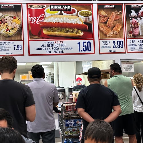 Customers wait their order in a food court at a wholesale store in Mount Prospect, Ill., Monday, June 8, 2026. (AP Photo/Nam Y. Huh)
