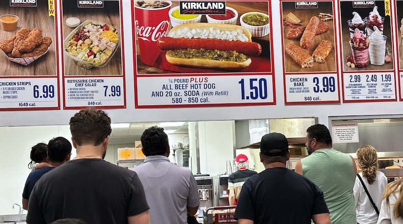 Customers wait their order in a food court at a wholesale store in Mount Prospect, Ill., Monday, June 8, 2026. (AP Photo/Nam Y. Huh)