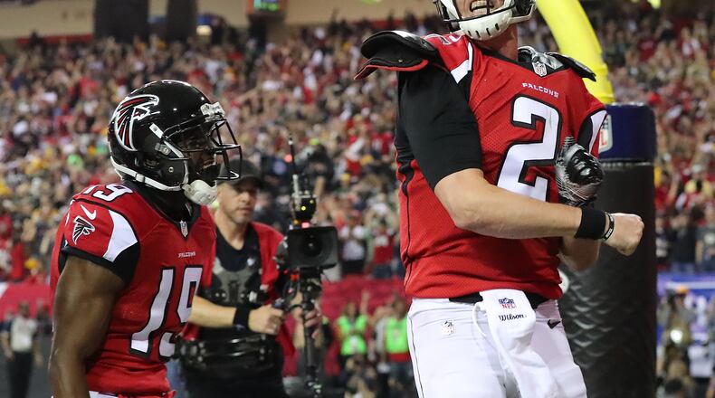 Falcons quarterback Matt Ryan reacts to scoring a touchdown on a quarterback keeper in the first half of the NFC Championship Game against the Green Bay Packers Sunday, Jan. 22, 2017, in Atlanta. (Curtis Compton/ccompton@ajc.com)