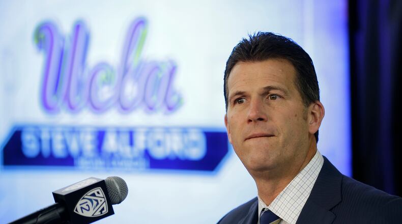 In this Oct. 12, 2017, file photo, UCLA coach Steve Alford listens to questions during the Pac-12's NCAA college basketball media day, in San Francisco. Alford will sit the three players involved in a shoplifting incident in China for Saturday's game against Georgia Tech in Shanghai. Alford, however, declined to address the issue further. (AP Photo/Eric Risberg, File)