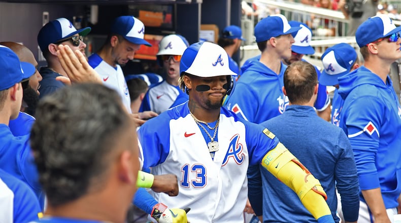 Atlanta Braves' right fielder Ronald Acuna Jr. (13) celebrates with teammates after hitting a solo home run during the first inning at Truist Park, Saturday, July 1, 2023, in Atlanta. (Hyosub Shin / Hyosub.Shin@ajc.com)
