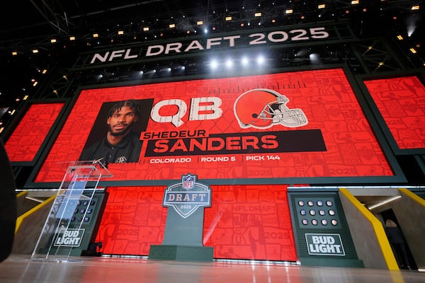 A screen shows Colorado quarterback Shedeur Sanders after being chosen by the Cleveland Browns with the 144th overall pick during the third day of the NFL football draft, Saturday, April 26, 2025, in Green Bay, Wis. (AP Photo/Jeff Roberson)