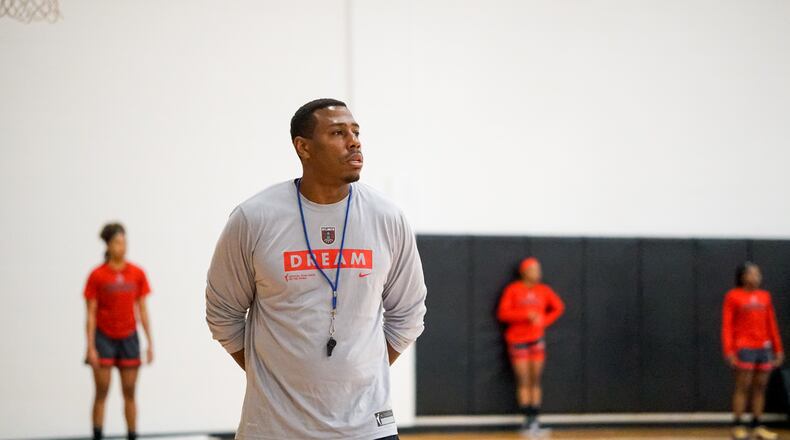 Darius Taylor, interim coach of the Atlanta Dream, watches his team during his first practice as interim coach, July 28, 2021, at Agnes Scott College in Decatur. (Photo courtesy of Kelsey Bibik/Atlanta Dream)
