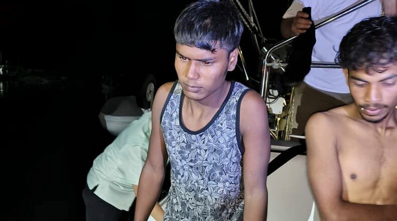 This photo released by Malaysian Maritime Enforcement Agency shows migrants handed over to authorities after they were rescued by a sailboat, in waters off northern resort island of Langkawi, Malaysia, Saturday, Nov. 8, 2025. (Malaysian Maritime Enforcement Agency via AP)