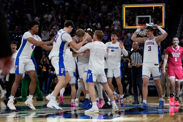 Florida players celebrate their win over Texas Tech in the Elite Eight of the NCAA college basketball tournament, Saturday, March 29, 2025, in San Francisco. (AP Photo/Godofredo A. Vásquez)
