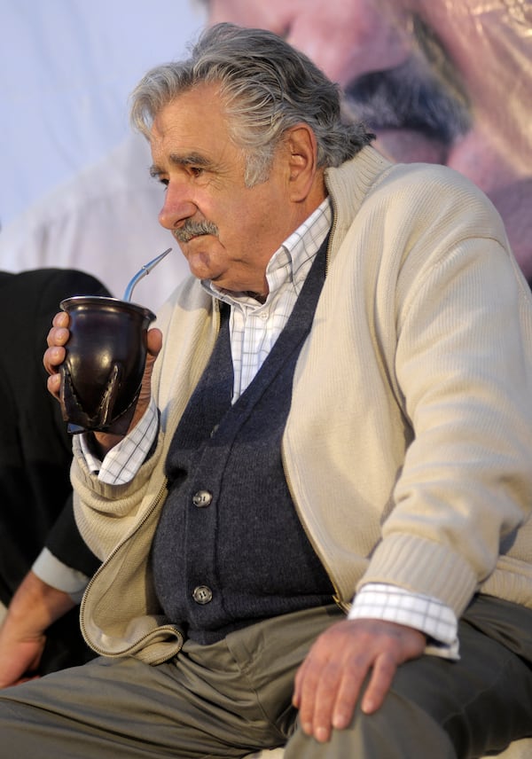 FILE - Presidential candidate Jose Mujica drinks mate during a closing campaign rally in Pando, Uruguay, Oct. 22, 2009. (AP Photo/Matilde Campodonico, File)