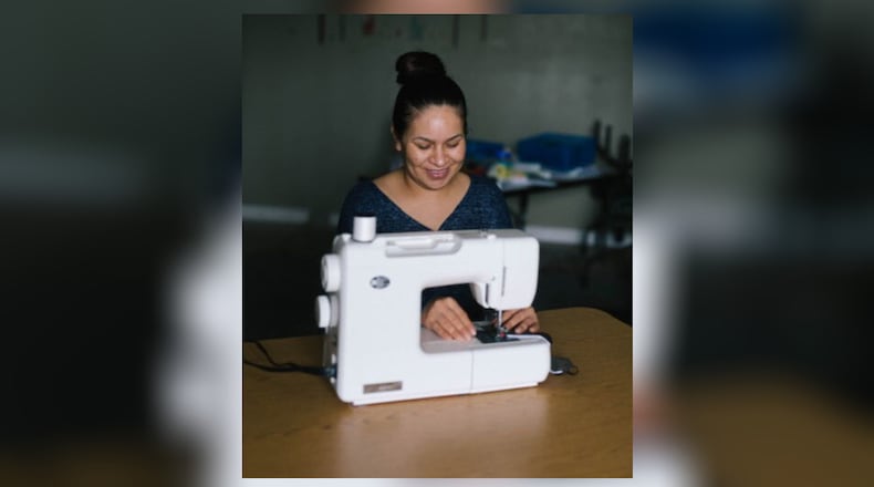 More Than a Mask employs women making masks from home.