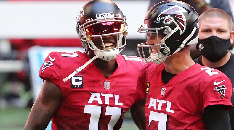Falcons quarterback Matt Ryan (2) and wide receiver Julio Jones (11) take the field ahead of game against the Detroit Lions Sunday, Oct 25, 2020, at Mercedes-Benz Stadium in Atlanta. (Curtis Compton / Curtis.Compton@ajc.com)