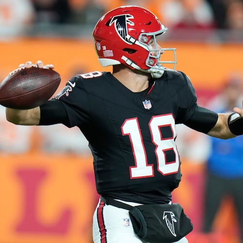 Atlanta Falcons quarterback Kirk Cousins (18) passes in the pocket against the Tampa Bay Buccaneers during the first half of an NFL football game, Thursday, Dec. 11, 2025, in Tampa, Fla. (AP Photo/Chris O'Meara)