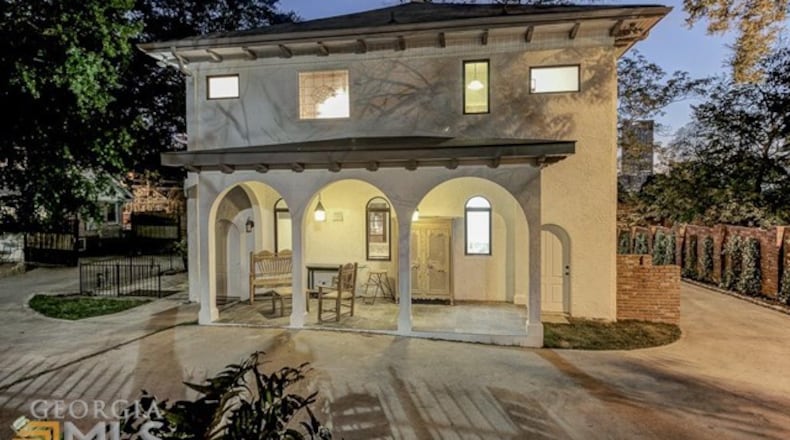 Ooh la la, this entrance! A dual-remote gated entry, porches and 8-foot doors lead inside to rooms with 20-foot vaulted ceilings.