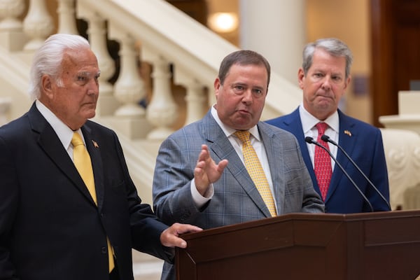 (Left to right) Georgia Public Service Commission commissioner Lauren “Bubba” McDonald, Chairman Jason Shaw and Gov. Brian Kemp appeared at a news conference at the Capitol in Atlanta on Wednesday.