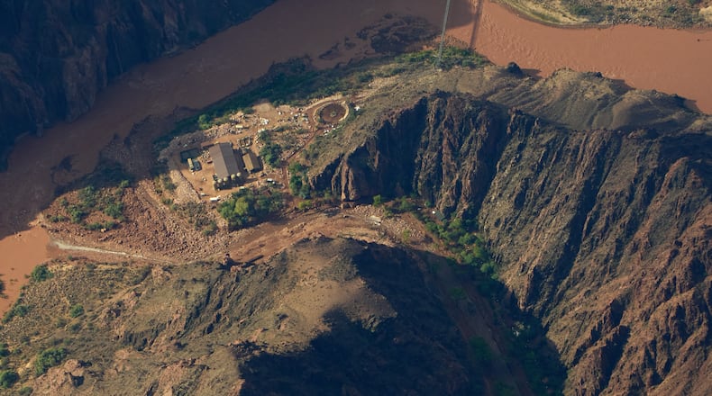 Flood debris lines Bright Angel Canyon near where it meets the Colorado River in the Grand Canyon, Monday, Aug. 31, 2026, at Grand Canyon National Park, Ariz. (AP Photo/John Locher)