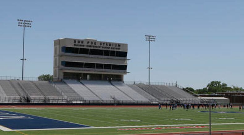 FILE - In this April 28, 2016, file photo, middle schoolers use the field in Ron Poe Stadium in McKinney, Texas. Voters in McKinney Independent School District approved a bond issue Saturday, May 7, 2016, to build a new high school football stadium. (AP Photo/LM Otero, File)