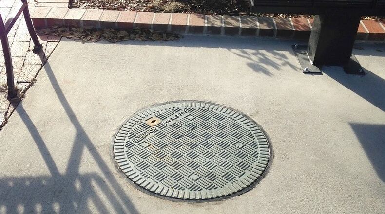 Fulton County Public Works have completed restoration of an underground pipe along Azalea/Riverside Drive in Roswell and the replacement of 18 manhole covers in the area. (Courtesy Fibrelite)
