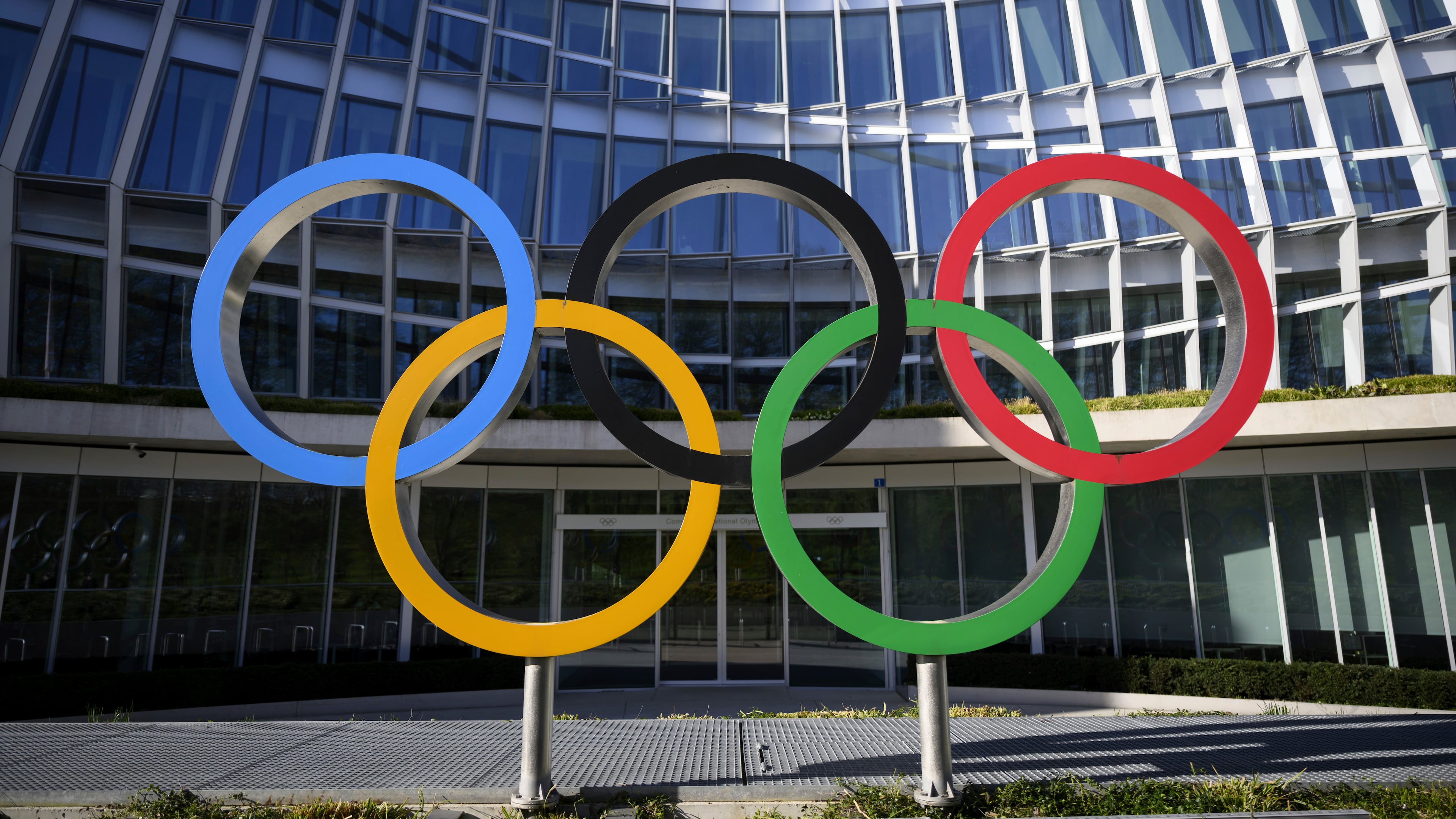 FILE -Olympic Rings are pictured in front of The Olympic House, headquarters of the International Olympic Committee (IOC) at the opening of the executive board meeting of the International Olympic Committee (IOC) in Lausanne, Switzerland, March 28, 2023. (Laurent Gillieron/Keystone via AP, File)