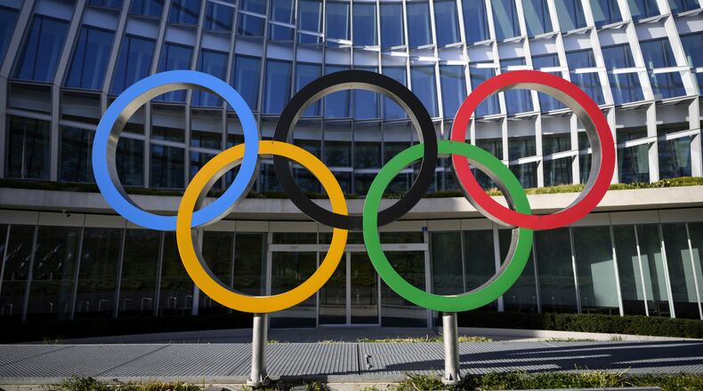 FILE -Olympic Rings are pictured in front of The Olympic House, headquarters of the International Olympic Committee (IOC) at the opening of the executive board meeting of the International Olympic Committee (IOC) in Lausanne, Switzerland, March 28, 2023. (Laurent Gillieron/Keystone via AP, File)