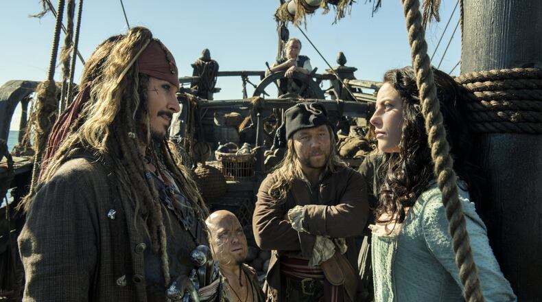 Johnny Depp portrays Jack Sparrow, left, and Kaya Scodelario portrays Carina Smyth, right, in a scene from “Pirates of the Caribbean: Dead Men Tell No Tales.” Contributed by Peter Mountain/Disney via AP