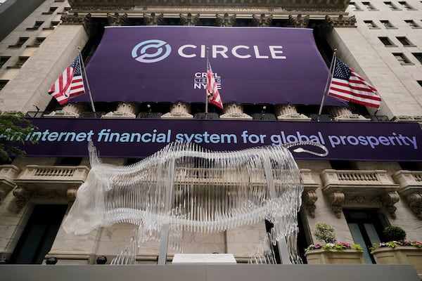 A bull sculpture is displayed outside the New York Stock Exchange for the expected Circle IPO, Thursday, June 5, 2025. (AP Photo/Richard Drew)
