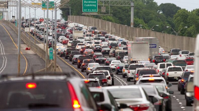 Cars backed up as the Georgia Department of Transportation reopened the northbound lanes of the rebuilt portion of I-85 in Atlanta on Friday evening, May 12, 2017. STEVE SCHAEFER/SPECIAL TO THE AJC