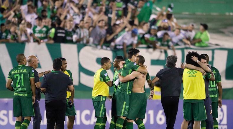 In this Wednesday, Nov. 23, 2016, file photo, players of Brazil's Chapecoense celebrate at the end of a Copa Sudamericana semifinal soccer match against Argentina's San Lorenzo in Chapeco, Brazil. (AP Photo/Andre Penner, File)