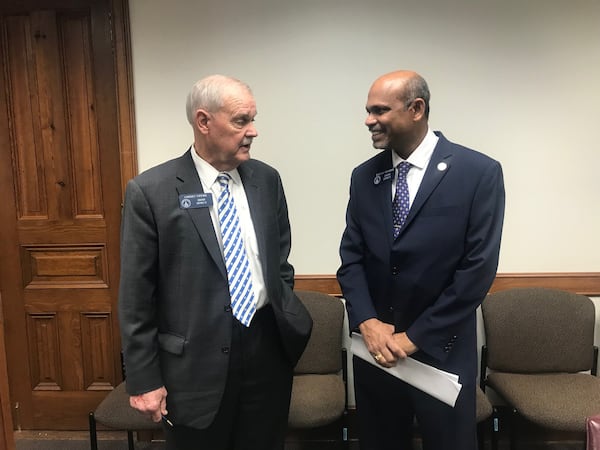 State Sen. Lindsey Tippins, R-Marietta, and Sen. Sheikh Rahman, D-Lawrenceville, discuss Rahman’s legislation that would allow some Georgia college students to get loans if they agree to pay them back with a portion of their future earnings. ERIC STIRGUS / ESTIRGUS@AJC.COM