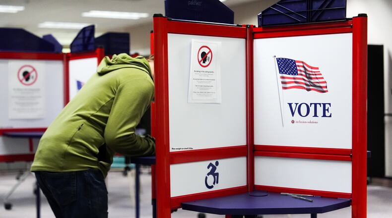 A person votes early in the Virginia redistricting referendum at the Fairfax County Government Center, Friday, April 3, 2026, in Fairfax, Va. (AP Photo/Julia Demaree Nikhinson)
