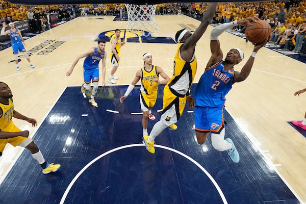Oklahoma City Thunder guard Shai Gilgeous-Alexander (2) drives to the basket against Indiana Pacers forward Pascal Siakam (43) during the second half during the first half of Game 6 of the NBA Finals basketball series, Thursday, June 19, 2025, in Oklahoma City. (Kyle Terada/Pool Photo via AP)
