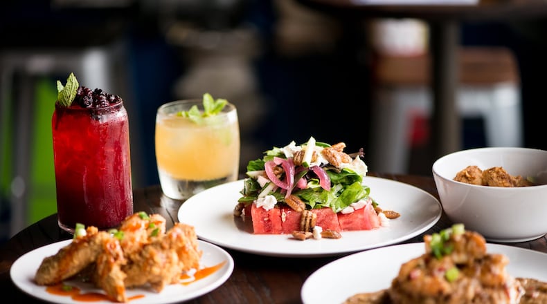 Virgil's Gullah Kitchen and Bar Watuhmelon and Cucumba Salad, Shark Bites, Shrimp and Crab Gravy, Jam Up Wings, Get Tight Up and Virgil's Tea cocktails. Photo credit- Mia Yakel.