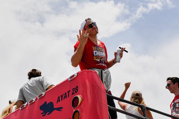 Florida Panthers' Matthew Tkachuk shows his championship ring during the NHL hockey team's Stanley Cup championship celebration, Sunday, June 20, 2022, in Fort Lauderdale, Fla. (AP Photo/Michael Laughlin)