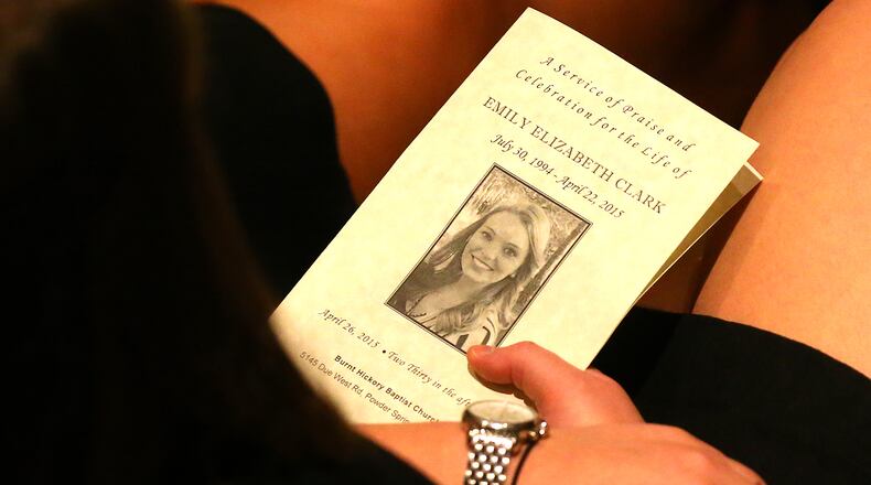 A mourner dressed in black holds the program while attending a service of praise and celebration for the life of Emily Elizabeth Clark at Burnt Hickory Baptist Church on Sunday, April 26, 2015, in Powder Springs. Clark and four other nursing students from Georgia Southern University were killed in a multi-vehicle accident while fulfilling course work in their nursing program last week. Curtis Compton / ccompton@ajc.com