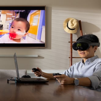 Kennesaw State University assistant professor of game development Lei Zhang presents his latest project. The virtual reality system is designed to aid parents in grief therapy. (Courtesy of Matt Yung/Kennesaw State University)