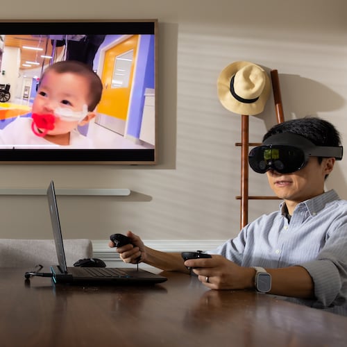 Kennesaw State University assistant professor of game development Lei Zhang presents his latest project. The virtual reality system is designed to aid parents in grief therapy. (Courtesy of Matt Yung/Kennesaw State University)