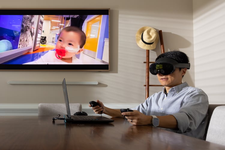 Kennesaw State University assistant professor of game development Lei Zhang presents his latest project. The virtual reality system is designed to aid parents in grief therapy. (Courtesy of Matt Yung/Kennesaw State University)