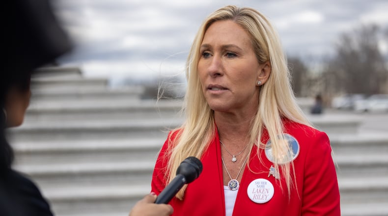U.S. Marjorie Taylor Greene was among dozens of public officials across the nation targeted by hoax emergency calls known as swatting. Federal officials have identified two foreign nationals they say made the calls. (File)