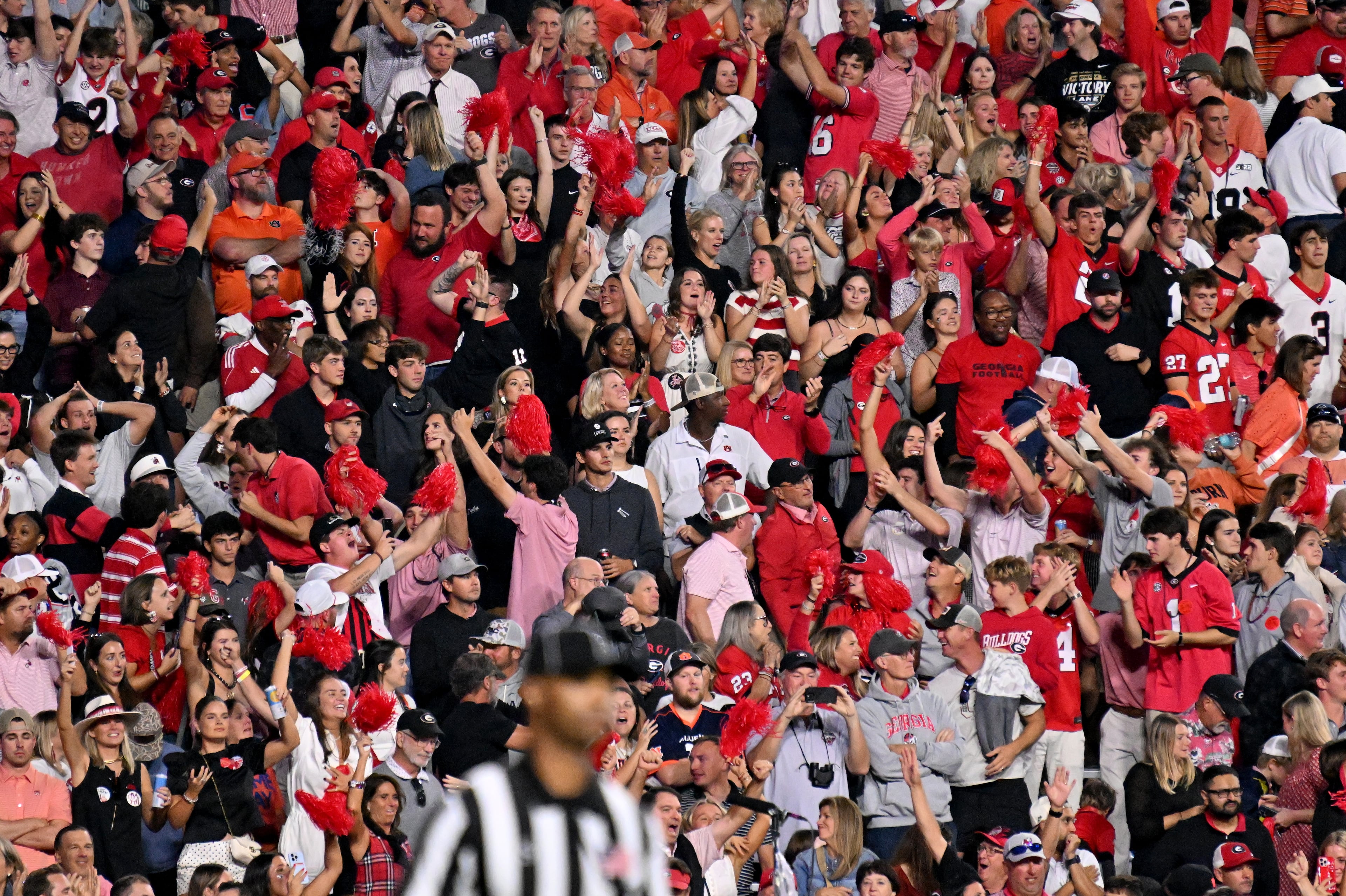 Georgia fans cheer after a touchdown by quarterback Gunner Stockton during the second half in a NCAA college football game at Jordan-Hare Stadium, Saturday, October 11, 2025, in Auburn, Ala. Georgia won 20-10 overAuburn. (Hyosub Shin / AJC)