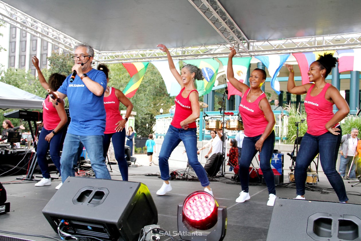 When Julian Mejia (pictured in blue), founder of SALSAtlanta, first moved to Atlanta in the 1990s, he found no one was dancing casino as they had been in Miami. He introduced Atlantans to the Cuban form and has been teaching it ever since. (Courtesy of Julian Mejia Photography)