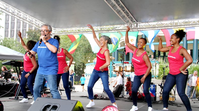 When Julian Meija (pictured in blue), founder of SALSAtlanta, first moved to Atlanta in the 1990s, he found no one was dancing casino as they had been in Miami. He introduced Atlantans to the Cuban form and has been teaching it ever since. (Courtesy of Julian Mejia Photography)