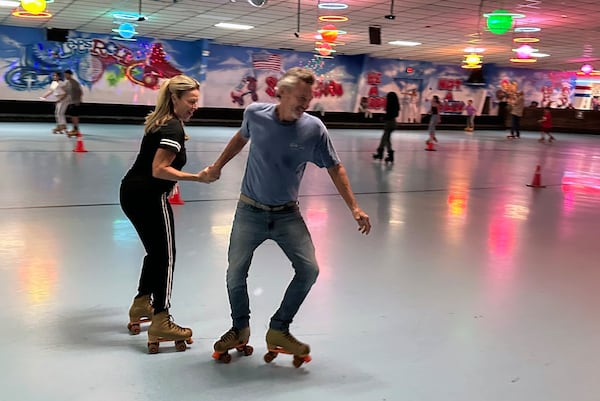 Tim Thomas used to come to Skate Along USA at Lilburn as a teenager. Now 63 ,he heard it was shutting down so he showed up to skate with his girlfriend Ruth Ungerer. (Rodney Ho/AJC)
