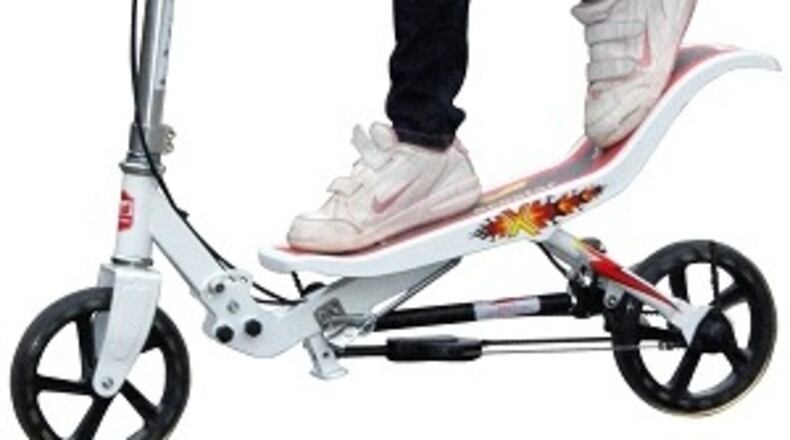 The hybrid scooter is propelled forward by pushing the board with both feet in a teeter-totter motion.