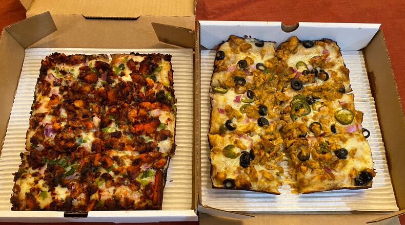 Rice N' Pie offers Detroit-style pizzas with Indian toppings, including the spicy 65 (left) and milder Butter Chicken (right).
Ligaya Figueras / ligaya.figueras@ajc.com
