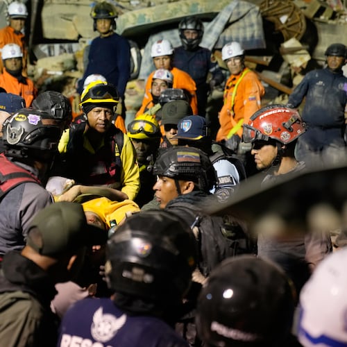 Rescue workers search through the rubble of a collapsed building after earthquake in Caracas, Venezuela, Wednesday, June 24, 2026. (AP Photo/Ariana Cubillos)