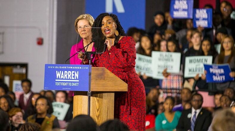 U.S. Rep. Ayanna Pressley, D-Mass., tells a group of protestors to quiet down after they erupted in chants at the start of Elizabeth Warren's speech during her campaign stop at Clark Atlanta University in Atlanta, Thursday, November 21, 2019. (Alyssa Pointer/Atlanta Journal Constitution)