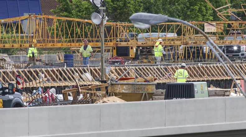 The I-85 bridge will reopen in time for Monday morning’s rush hour, state officials say. JOHN SPINK/JSPINK@AJC.COM