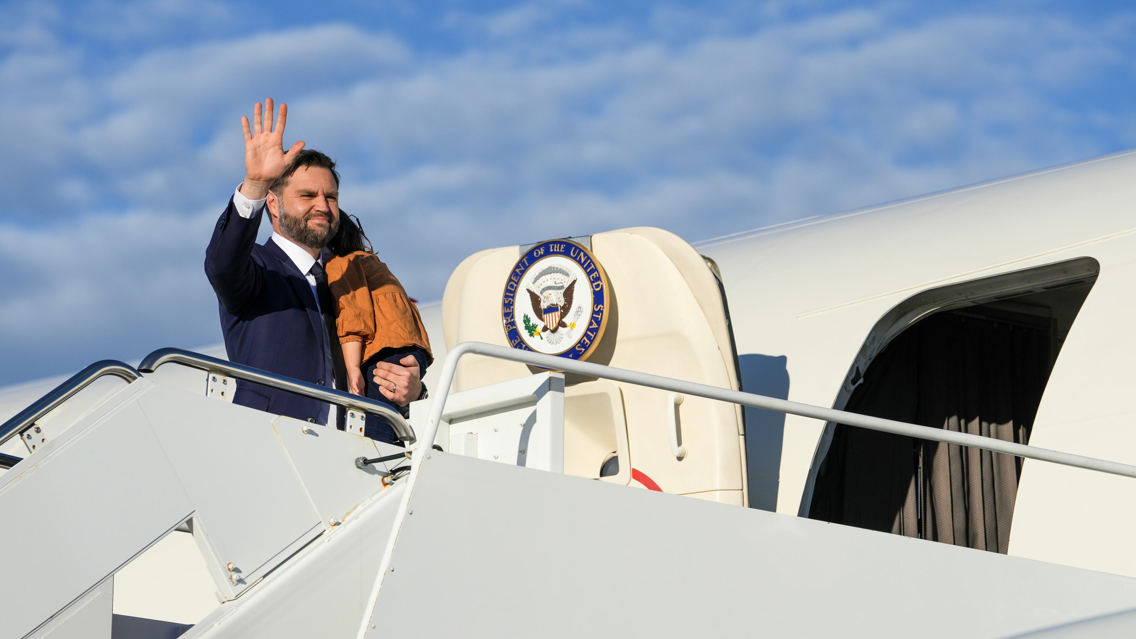 Vice President JD Vance waves as he boards Air Force Two at Joint Base Andrews, Md., Friday, Oct. 17, 2025. (Oliver Contreras/Pool via AP)