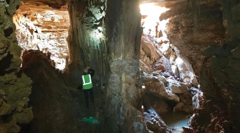 Cambria Drive will remain closed for several weeks while Williamson County and TCEQ staff determine the most appropriate way to repair a sinkhole that opens to a cave. (Photo: Austin American-Statesman)