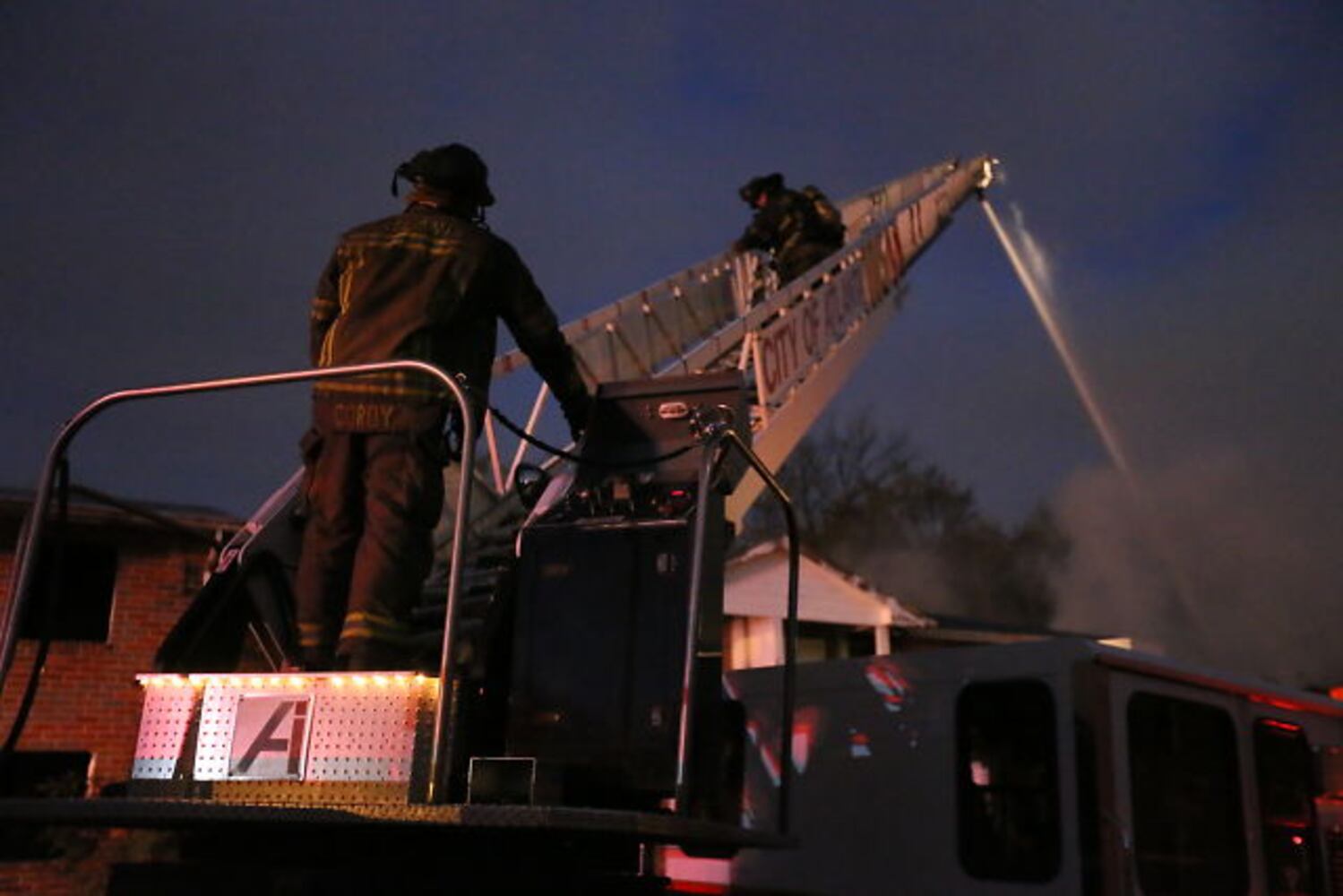 Firefighters contend with strong winds, cold weather