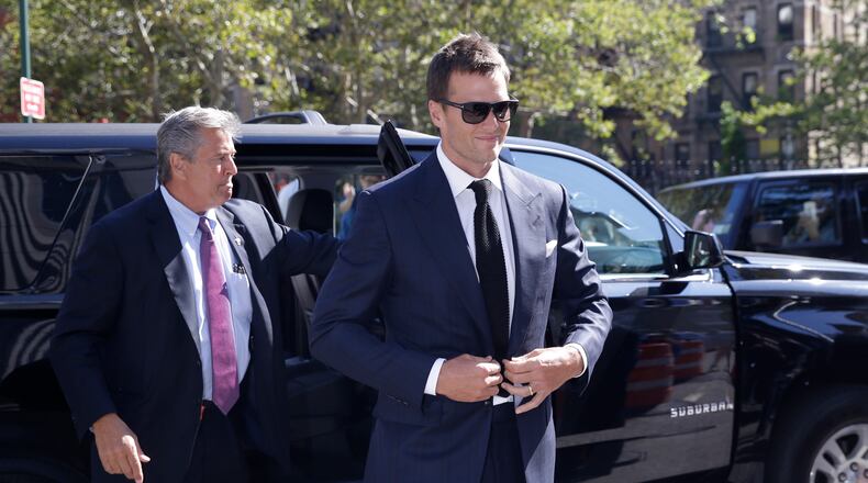 New England Patriots quarterback Tom Brady arrives at federal court, Wednesday in New York. Brady and NFL commissioner Roger Goodell explained to a judge why a controversy over underinflated footballs at last season's AFC conference championship game is spilling into a new season. (AP photo)
